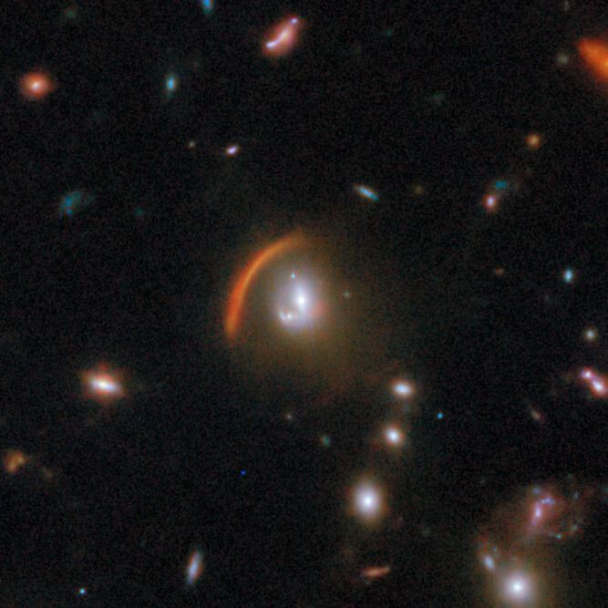 Gravitational lens COSJ100013+023424
