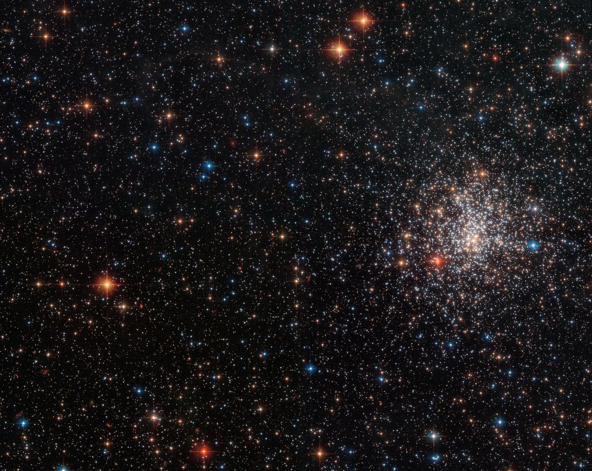 A globular cluster’s striking red eye