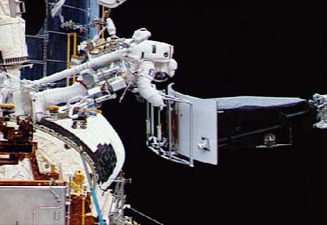 Astronaut Servicing the Hubble Space Telescope