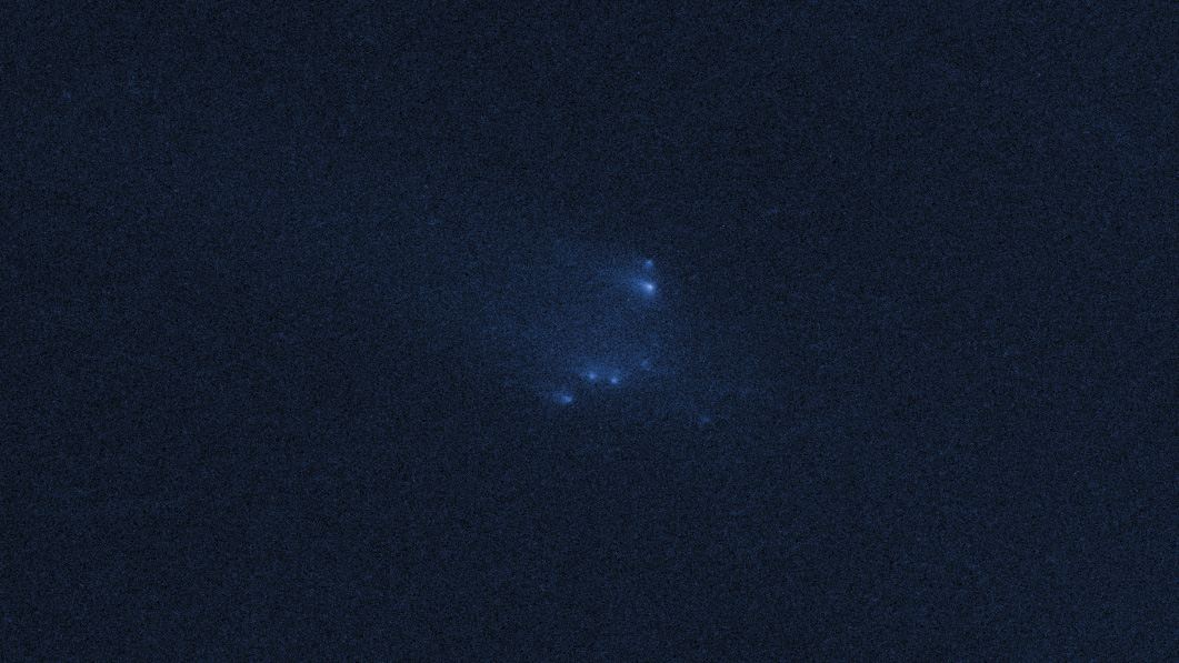 Disintegrating asteroid P2013 R3 as viewed by Hubble on 14 January 2014