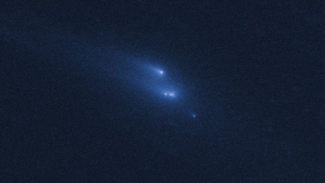 Disintegrating asteroid P2013 R3 as viewed by Hubble on 15 November 2013