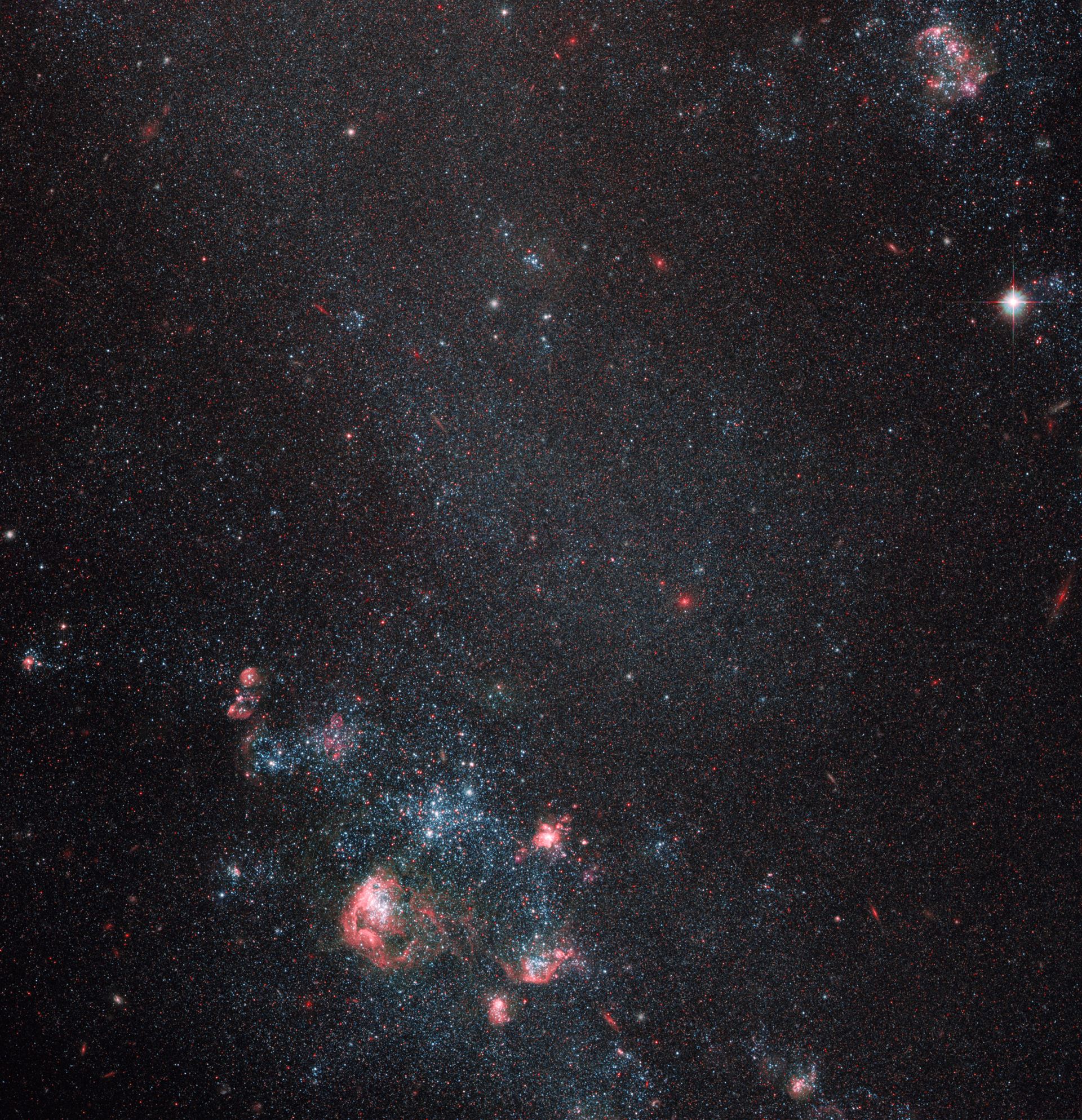 Faint galaxy with popping pink features
