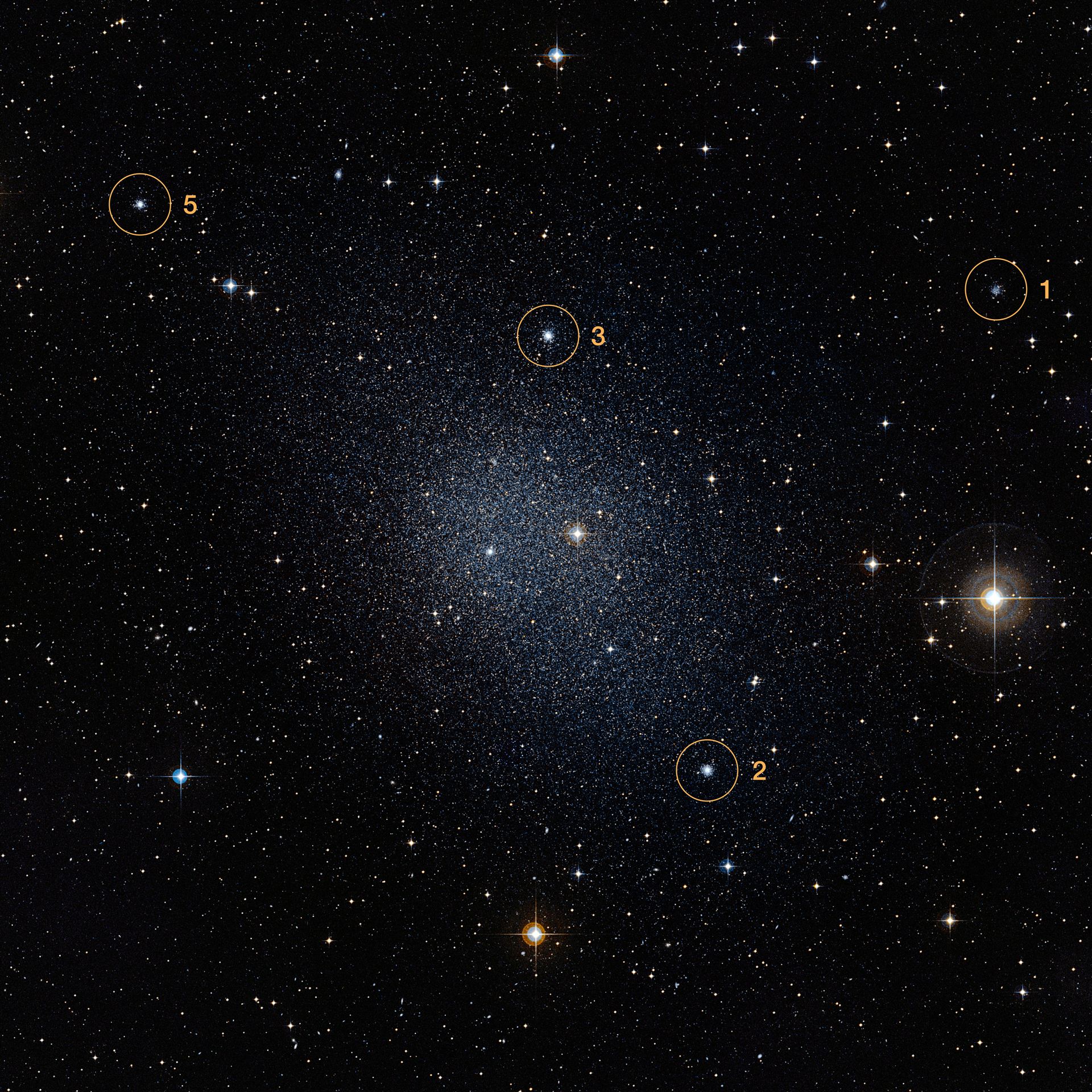 Fornax galaxy with four globular clusters marked