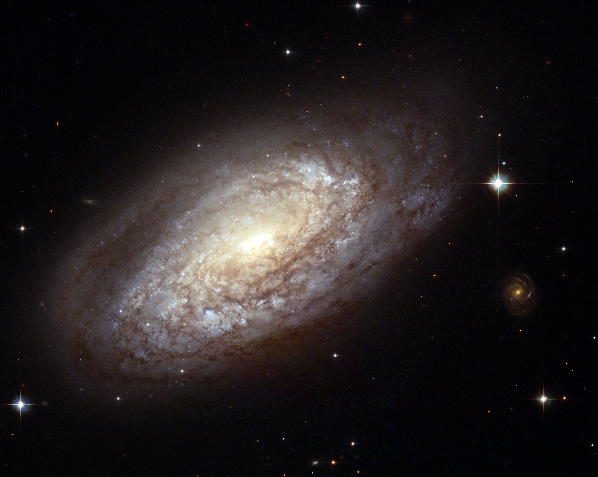 Galaxy NGC 2397 with an explosive secret