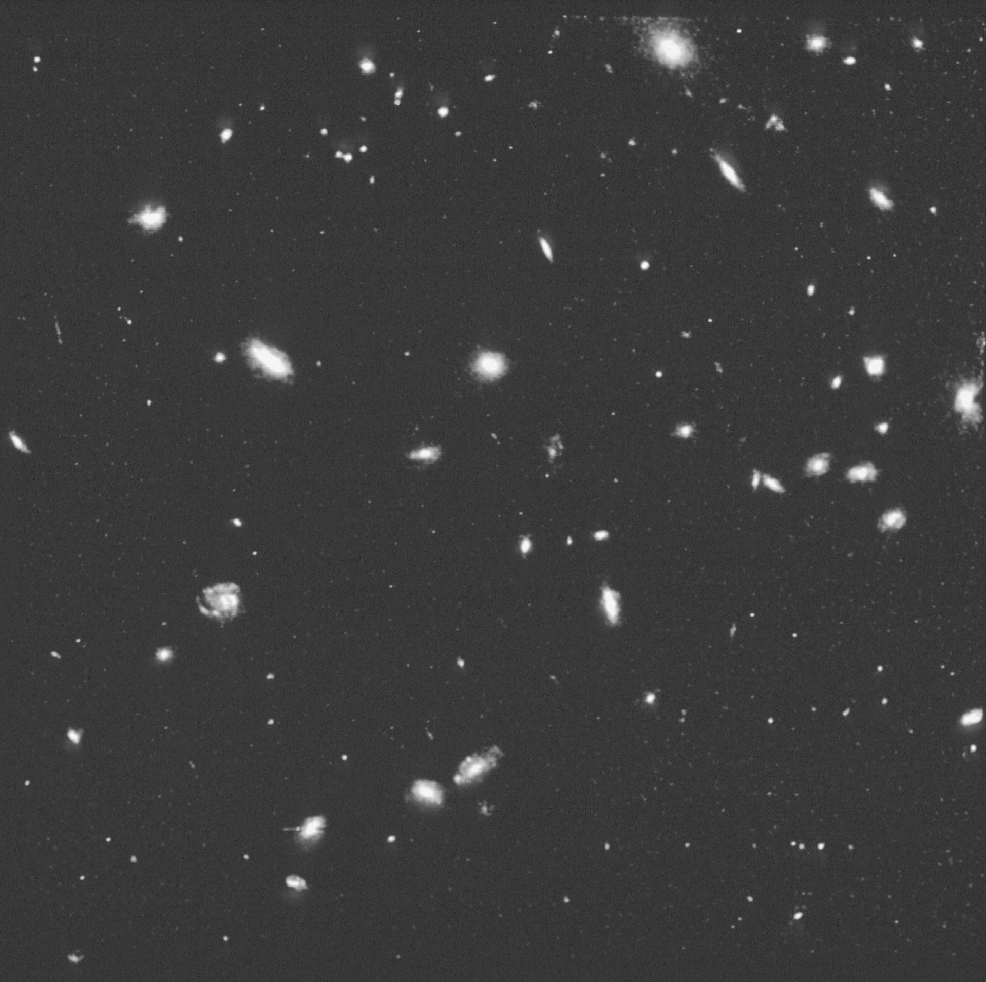 HST photographs a cluster of galaxies four billion light-years away