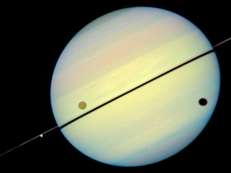 Hubble Catches Titan Chasing Its Shadow – Frame 1