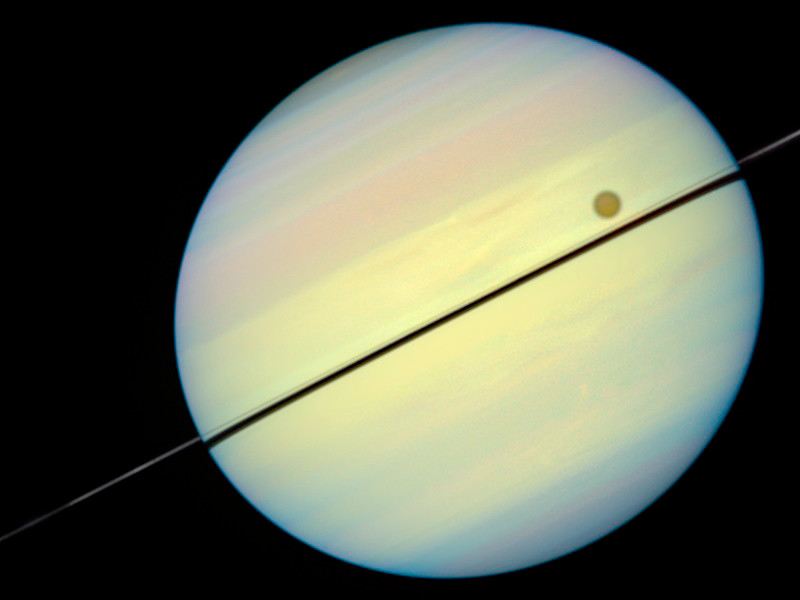 Hubble Catches Titan Chasing Its Shadow – Frame 6