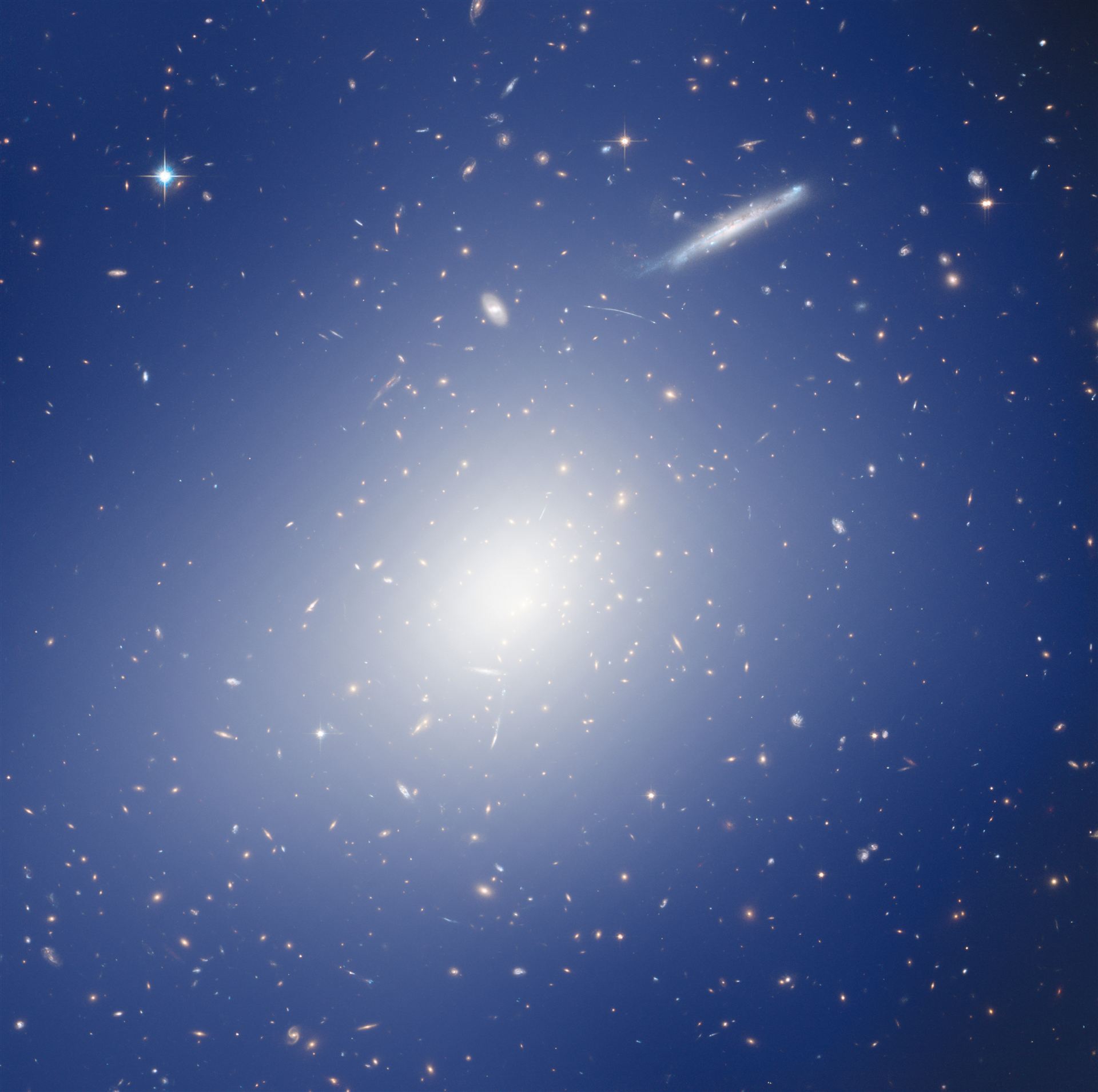 Hubble and HAWK-I explore a cluster with the mass of two quadrillion Suns