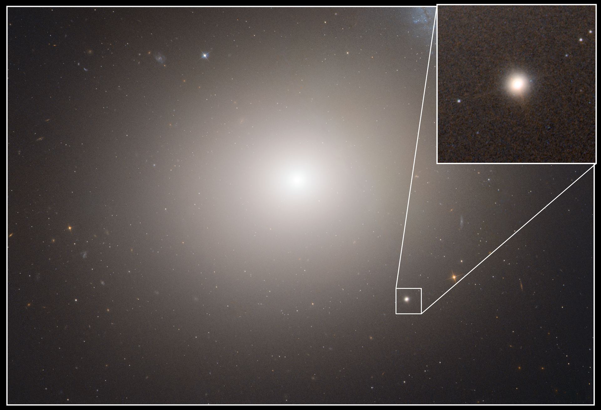 Hubble image of Messier 60 and M60-UCD1